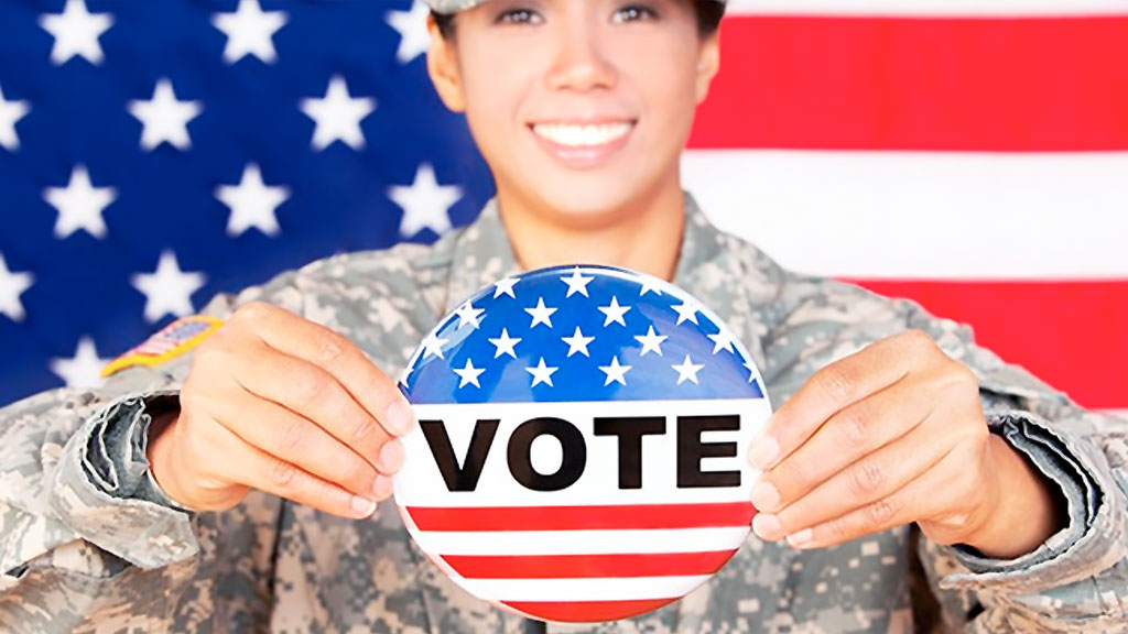 Military women holding a voting button